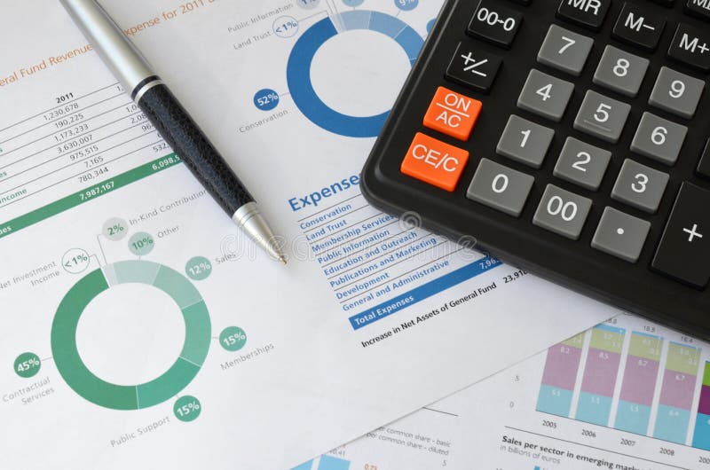 Calculator, pen and graph stock photos