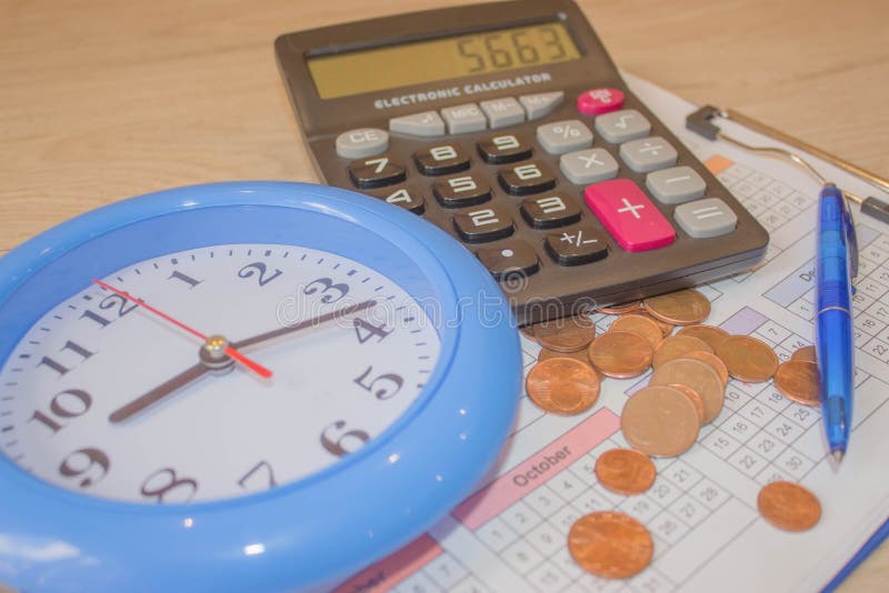 Calculator with Pen and Money on Calendar. Coin Stack with a Clock