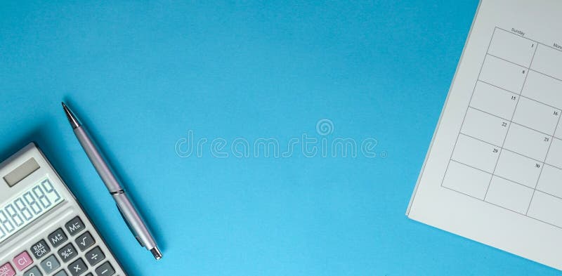 Calculator, Pen and Table Calendar on Blue Background. Top View of Office  Desk Stock Photo - Image of finance, outstanding: 179944470