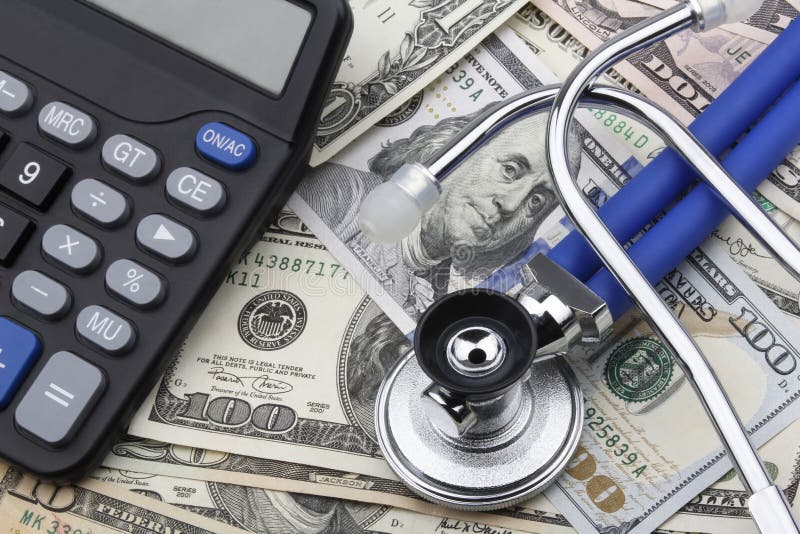 Calculator and Stethoscope on top of US Dollar (USD) banknotes.