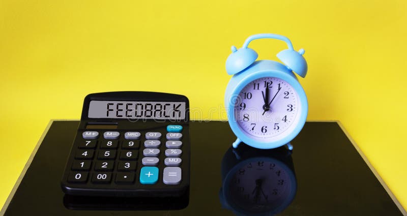 On the calculator, the word FEEDBACK. stock photo