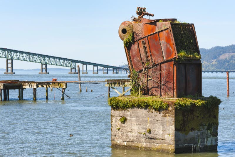 Large rusted out boiler is the remnant of White Star Cannery that was destroyed by fire over 50 years ago in Astoria, Oregon. Large rusted out boiler is the remnant of White Star Cannery that was destroyed by fire over 50 years ago in Astoria, Oregon.