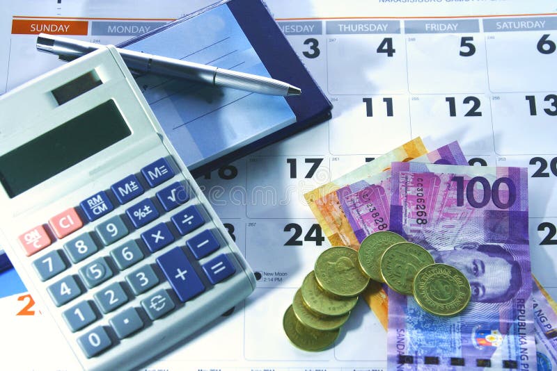 Calendar, Checkbook, Calculator, Money and a Ballpen Stock Photo