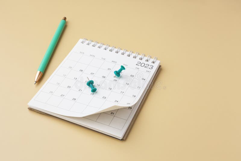 Scheduling and Planning Concept, Calendar with Green Pin, Pen and Clock 