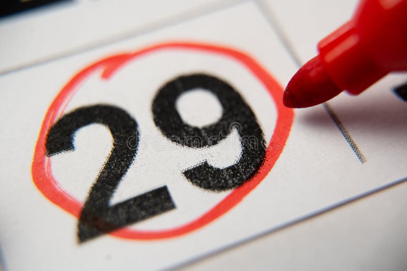 The Calendar 29th Day of the Month is Circled. a Red Marker Circles the