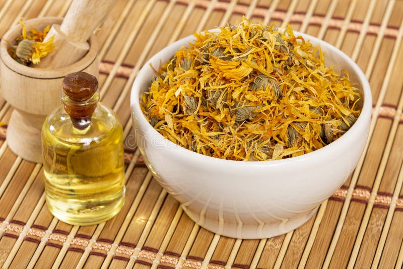 Calendula Officinalis Calendula Oil in a Glass Bottle Stock Photo