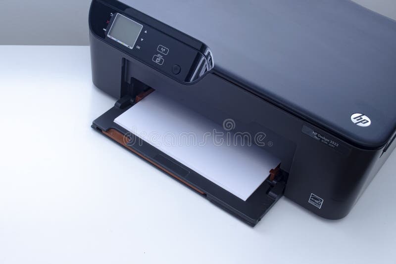 An HP Deskjet 3522 e-All-in-One Printer on a white table royalty free stock photography