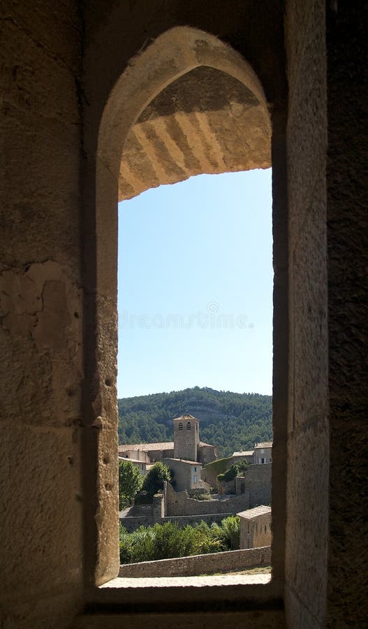 Village of Lagrasse through a window of the Abbey. Village of Lagrasse through a window of the Abbey