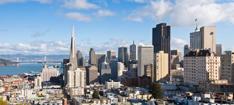 View of San Francisco downtown and financial district, with the Bay Bridge in the background. View of San Francisco downtown and financial district, with the Bay Bridge in the background.