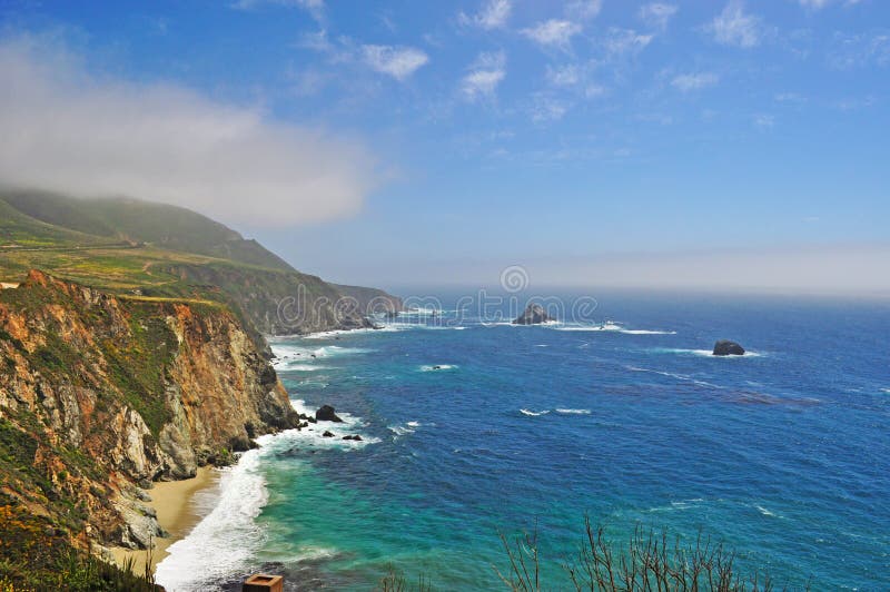 Pacific Ocean, mist and panoramic view in Big Sur on 8 June 2010. Big Sur, a region of the Central Coast of California, is one of the most popular tourist destination of California. Pacific Ocean, mist and panoramic view in Big Sur on 8 June 2010. Big Sur, a region of the Central Coast of California, is one of the most popular tourist destination of California