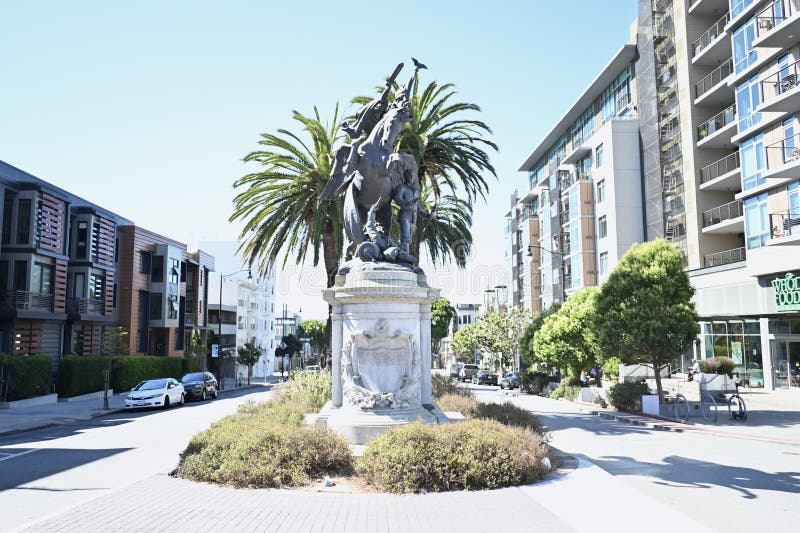 San Francisco California Volunteers Monument is a sculpture dedicated to the solders of the Spanish American War,of April through August 1898. Originally located on Van Ness Avenue at Market Street,the location was criticized as it made the statue,a granite base 10 feet (3 meters) tall holding the 16 foot (4.9 meter) tall by 10 foot (3 meter) long bronze sculpture look insignificant. This location,Dolores and Market Streets,was chosen as it really stands out much better. Although the figure riding the horse is supposed to be the ancient Roman Goddess Bellona,the Goddess of War,some people have thought it is Nike,the Greek Goddess of Victory. As seen 16 August 2023. San Francisco California Volunteers Monument is a sculpture dedicated to the solders of the Spanish American War,of April through August 1898. Originally located on Van Ness Avenue at Market Street,the location was criticized as it made the statue,a granite base 10 feet (3 meters) tall holding the 16 foot (4.9 meter) tall by 10 foot (3 meter) long bronze sculpture look insignificant. This location,Dolores and Market Streets,was chosen as it really stands out much better. Although the figure riding the horse is supposed to be the ancient Roman Goddess Bellona,the Goddess of War,some people have thought it is Nike,the Greek Goddess of Victory. As seen 16 August 2023.