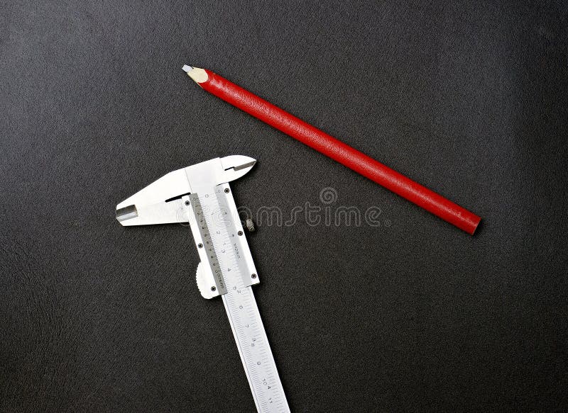 Caliper and red pencil stock photo. Image of instrument 18188562