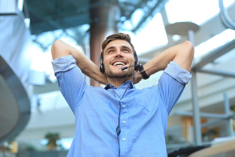 Call center operator in headset resting at workplace in office. royalty free stock photo Call center operator in headset resting at workplace in office. royalty free stock photo