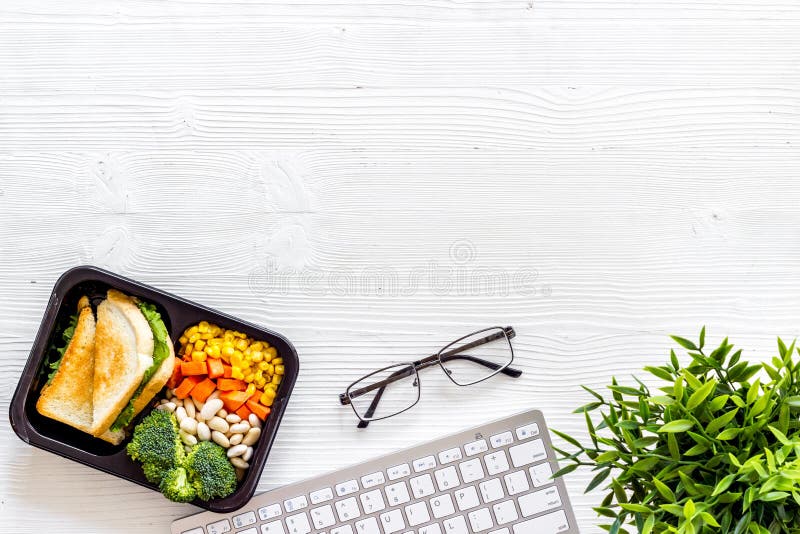 Call for Delivery Concept. Lunch Boxes with Meal on Working Place Stock