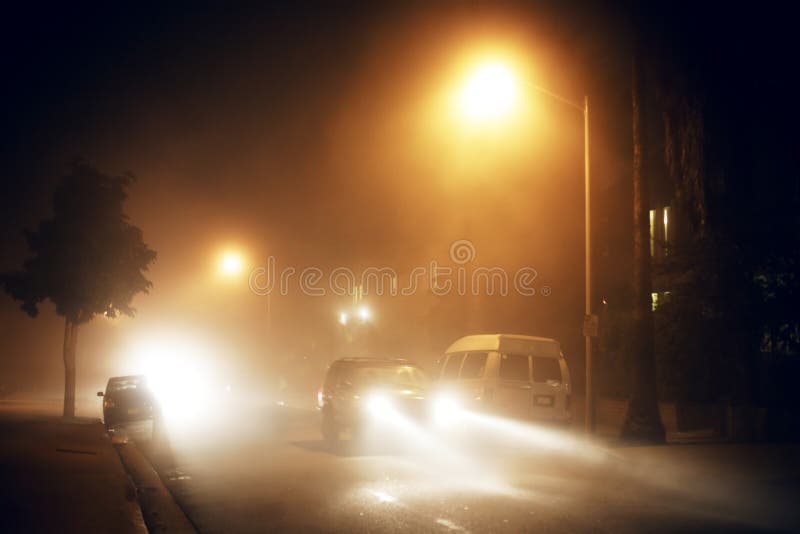 Traffic on foggy street at night. Traffic on foggy street at night