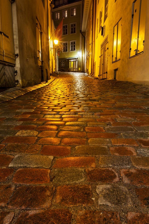 Tallinn Old Town street with cobblestones in night, Estonia. Tallinn Old Town street with cobblestones in night, Estonia