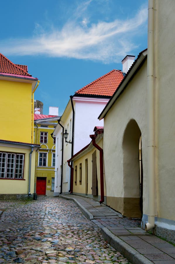 Narrow street with cobblestones in the old town of Tallinn, Estonia. Narrow street with cobblestones in the old town of Tallinn, Estonia