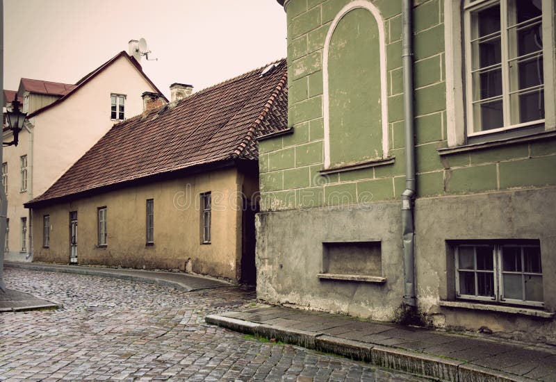 Narrow street with cobblestones in the old town of Tallinn, Estonia. Narrow street with cobblestones in the old town of Tallinn, Estonia