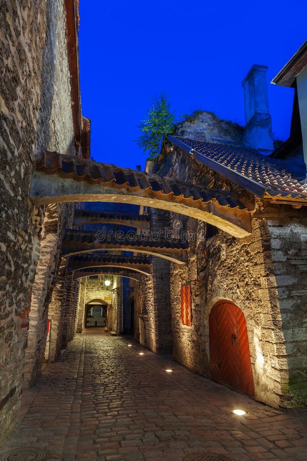 Medieval street - Saint Catherine Passage at night in Tallinn, Estonia. Medieval street - Saint Catherine Passage at night in Tallinn, Estonia.