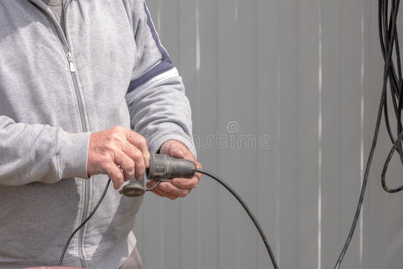 Male Hands In Gloves With A Screwdriver Screw The Roofing Sheet To The Roof  Stock Photo - Download Image Now - iStock