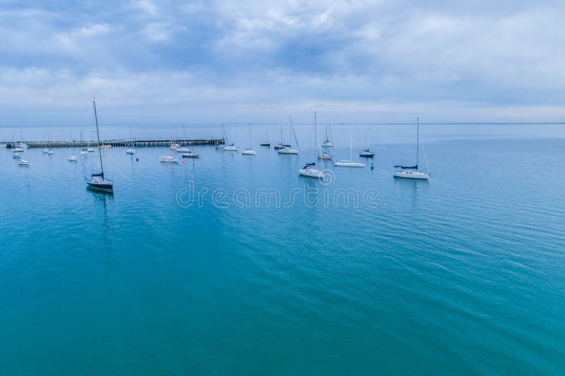 Calm Bay Waters and Moored Boats. Stock Photo Image of coastline