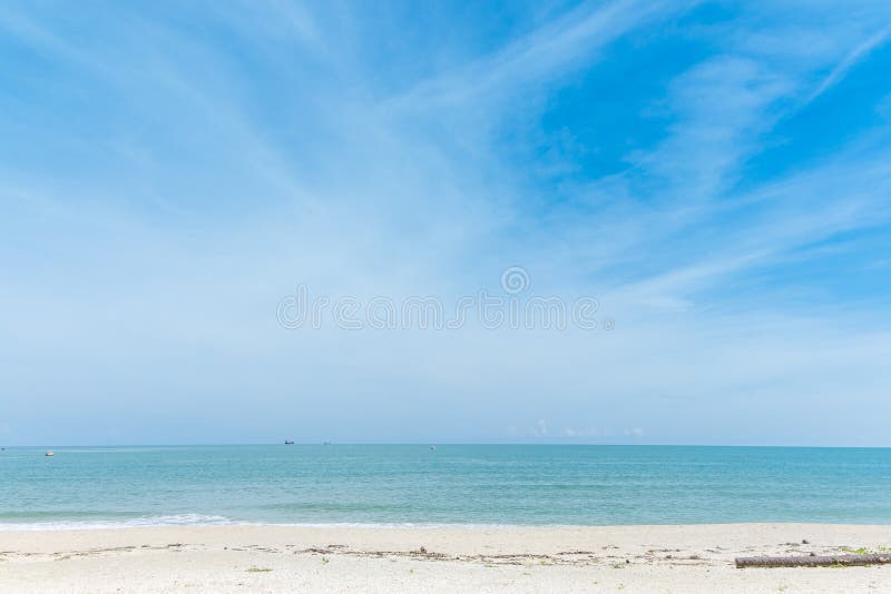 Calm beach in sunny blue sky day