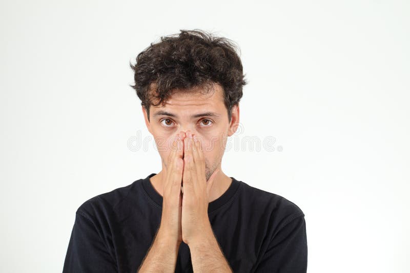 Calm boy in black T-shirt closing his nose royalty free stock images Calm boy in black T-shirt closing his nose royalty free stock images