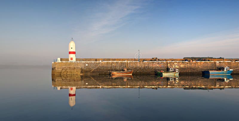 Calm Harbour, Lighthouse and Boats water reflect