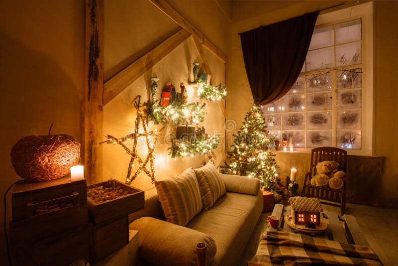 Calm image of interior modern home living room decorated christmas tree and gifts, sofa, table covered with blanket.