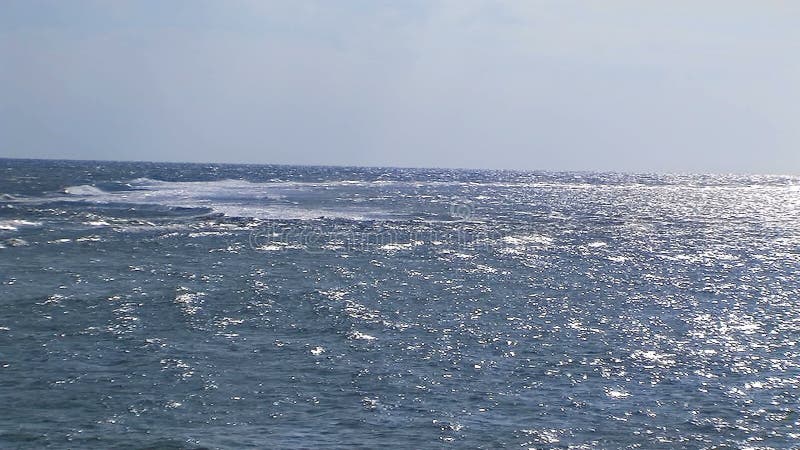 Calm ocean with blue sky. stock footage