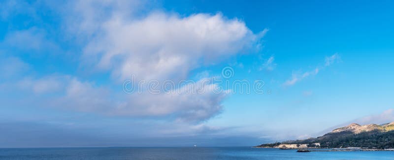 Calm sea and heavy clouds in the sky. Nature background stock photography