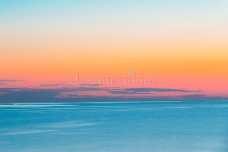 Calm Sea Or Ocean And Colorful Sunset Or Sunrise Sky Background.