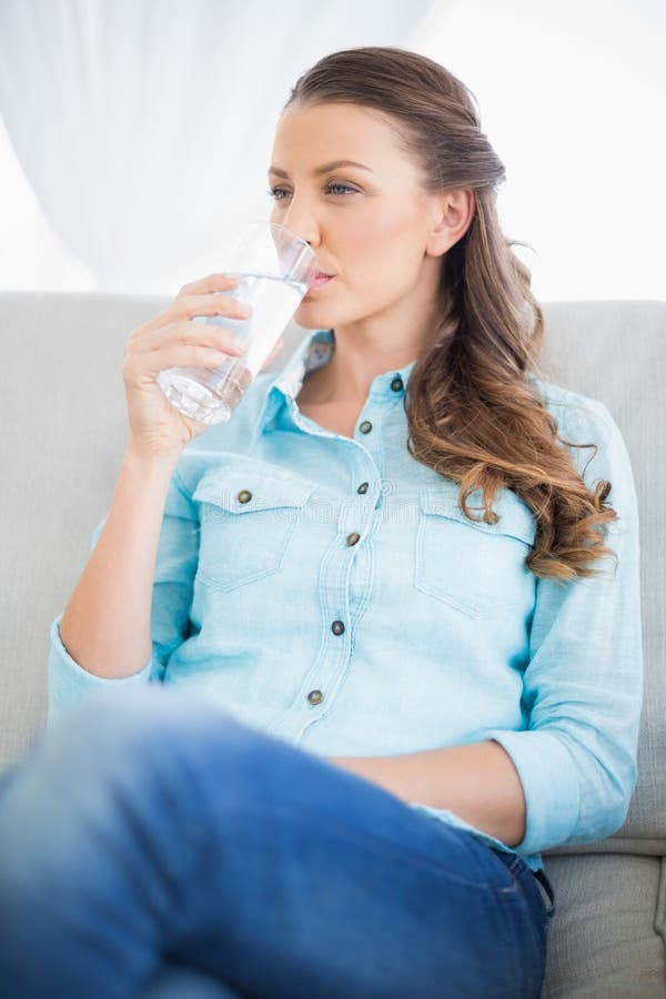 Calm woman drinking water stock image. Image of brown 33718921