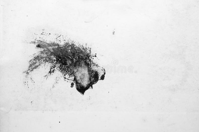 Calomnies d'encre sur le livre blanc photo stock Calomnies d'encre sur le livre blanc photo stock