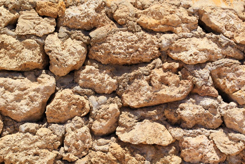 Calx lime stone brick background worn out old stones. Calx lime stone brick background worn out old stones