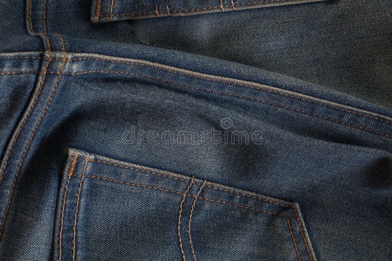 Calças de ganga traseira do detalhe fotografia de stock