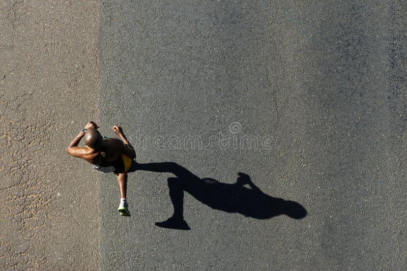 DURBAN, SOUTH AFRICA - 30 MAY 2010: Runners compete in the Comrades Marathon, an annual 90km road race that tests the greatest international long distance runners. DURBAN, SOUTH AFRICA - 30 MAY 2010. DURBAN, SOUTH AFRICA - 30 MAY 2010: Runners compete in the Comrades Marathon, an annual 90km road race that tests the greatest international long distance runners. DURBAN, SOUTH AFRICA - 30 MAY 2010.