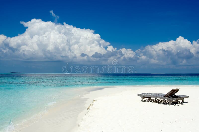 Sun beds on the beach of the ocean. Sun beds on the beach of the ocean