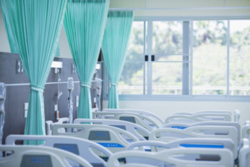 Blurred image.Patient beds in modern hospitals. Empty hospital bed with medical equipment. Concept of medical. sickness. Blurred image.Patient beds in modern hospitals. Empty hospital bed with medical equipment. Concept of medical. sickness