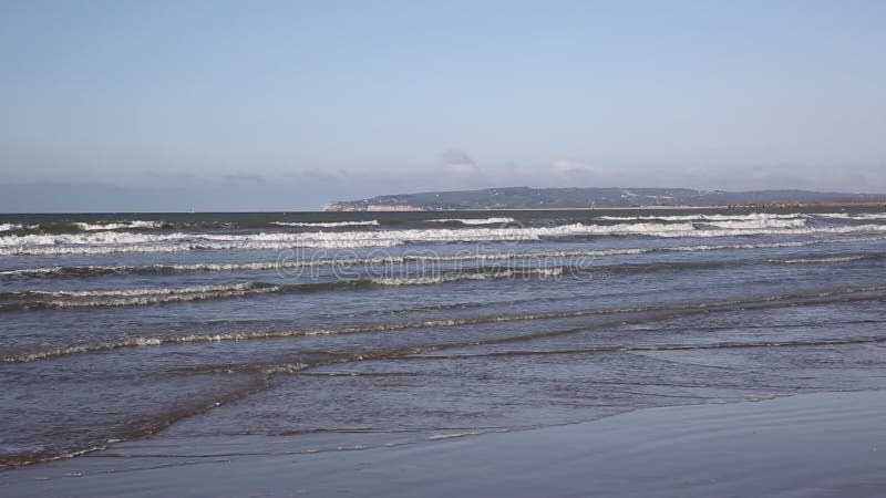 Camber Sands beach and waves East Sussex UK