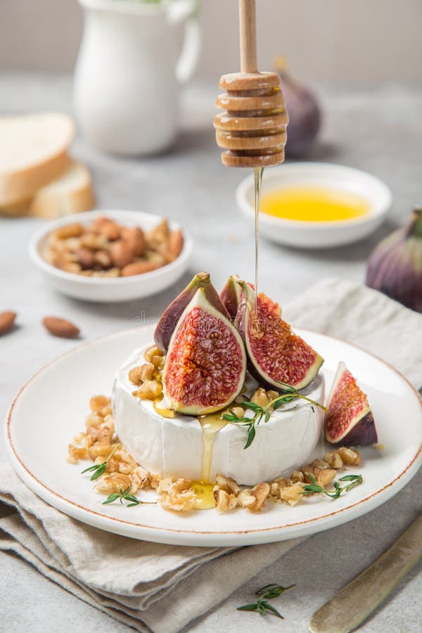 Camembert Cheese with Fresh Figs, Walnuts and Honey Stock Photo Image