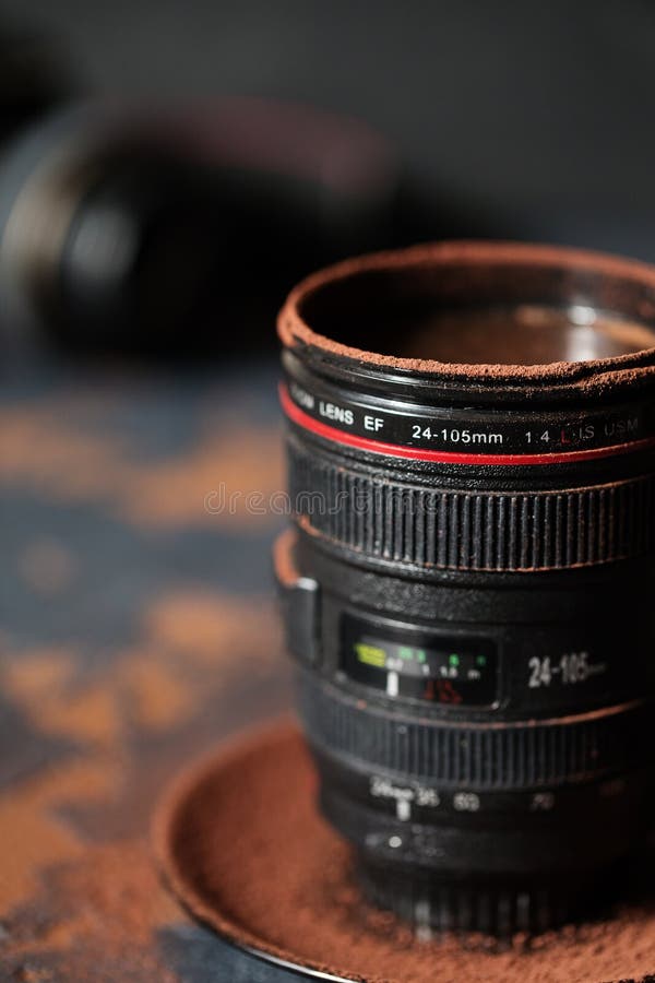 Camera Lens Cup with Hot Chocolate Sprinkled with Cocoa Stock Image