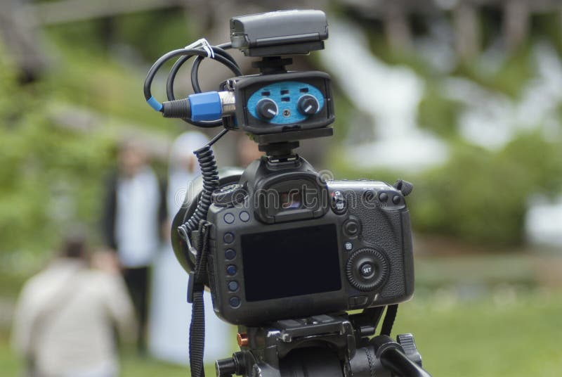 Modern Camera with Mic on Tripod Recording Nature Stock Photo Image