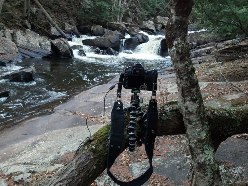 Camera mounted on Joby flexible tripod taking photograph of Austin Falls on the Sacandaga River near Speculator, NY in the Adirondacks. Camera mounted on Joby flexible tripod taking photograph of Austin Falls on the Sacandaga River near Speculator, NY in the Adirondacks