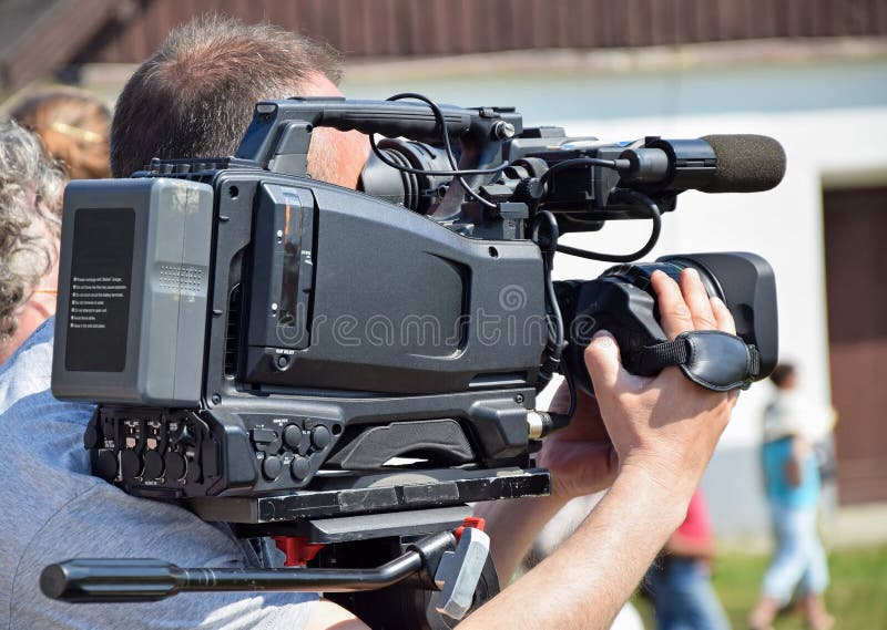 Cameraman Working In Broadcast Television Green Screen Studio R Stock
