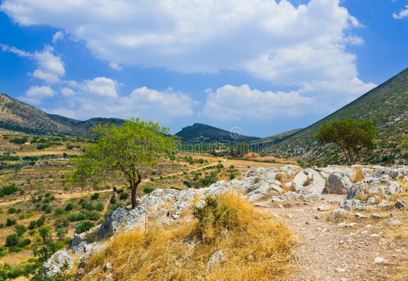 Pathway to mountains in Mycenae, Greece - travel background. Pathway to mountains in Mycenae, Greece - travel background