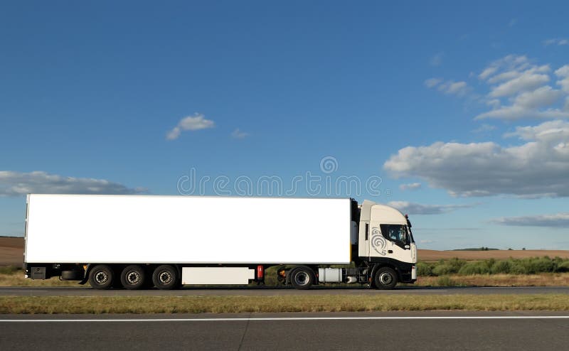 Long lorry with white truck and trailer on highway against blue sky. See my other best vans collection. Long lorry with white truck and trailer on highway against blue sky. See my other best vans collection.