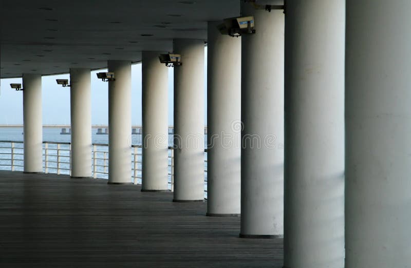 A path with seveal columns and vigilance cameras. A path with seveal columns and vigilance cameras