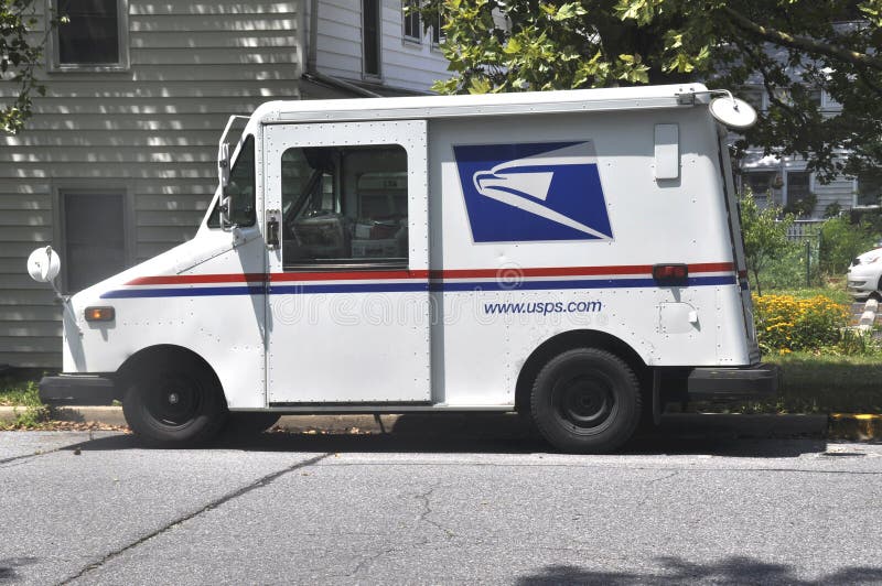 United States Postal Service truck parked while the mail carrier makes deliveries in Greenbelt, Marylandm. United States Postal Service truck parked while the mail carrier makes deliveries in Greenbelt, Marylandm