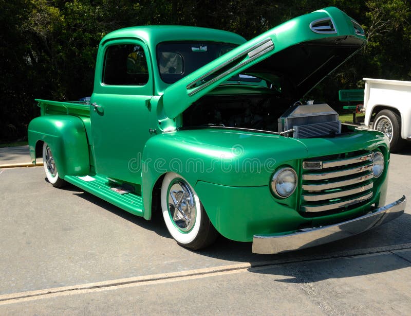 Green classic customized truck at an American car show. Green classic customized truck at an American car show.